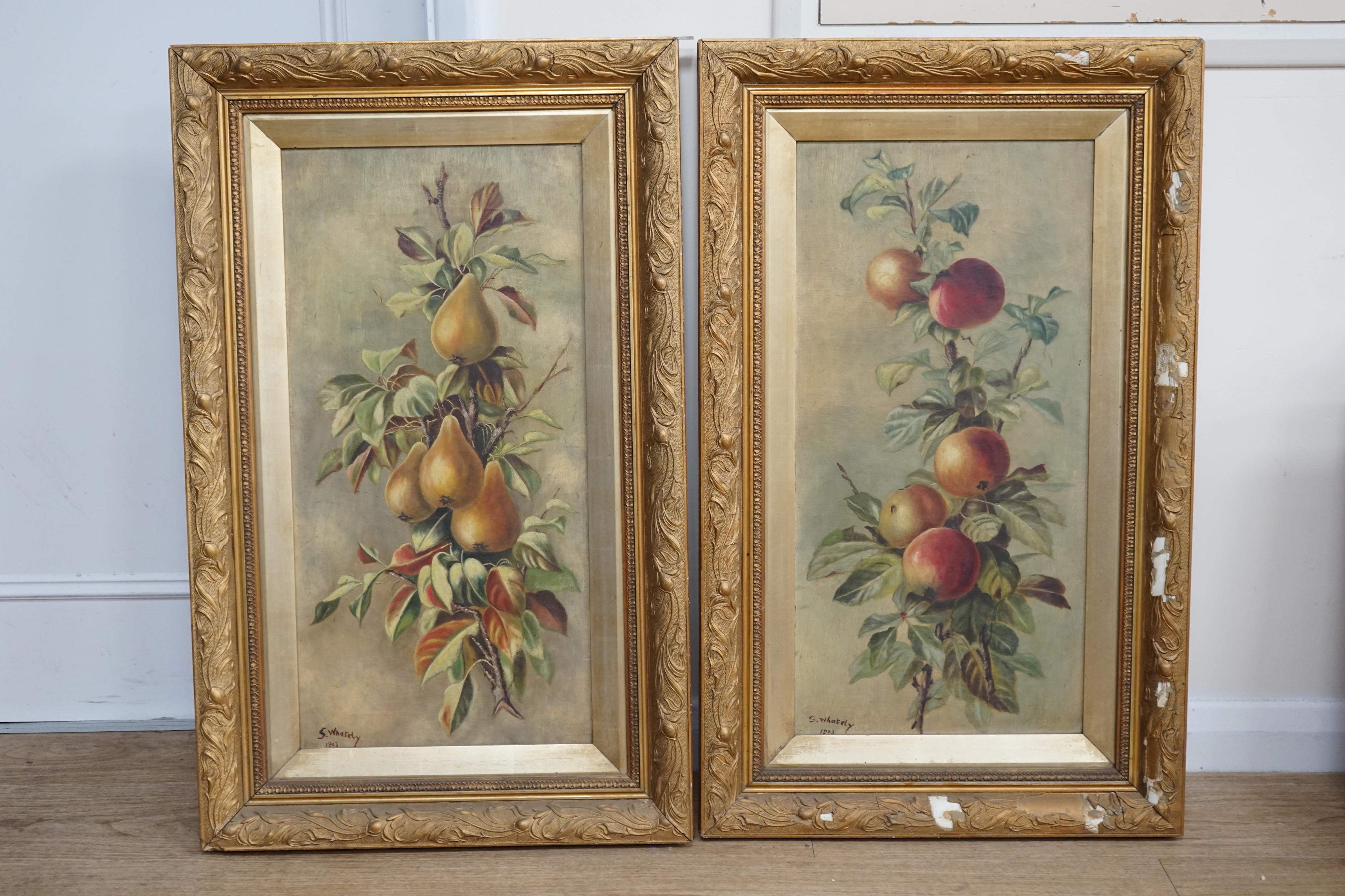 S. Whately, pair of oils on canvas, Still lifes of apples and pears, signed and dated 1903, 59 x 29cm